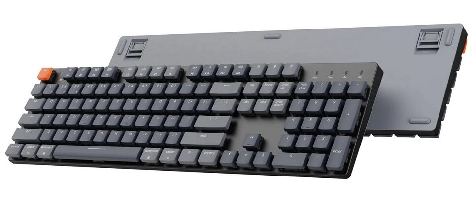 Тонкая механическая клавиатура Keychron K5 SE темно-серого цвета в двух ракурсах.