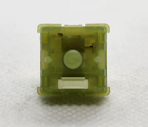 Механический переключатель зеленого цвета, вид снизу.